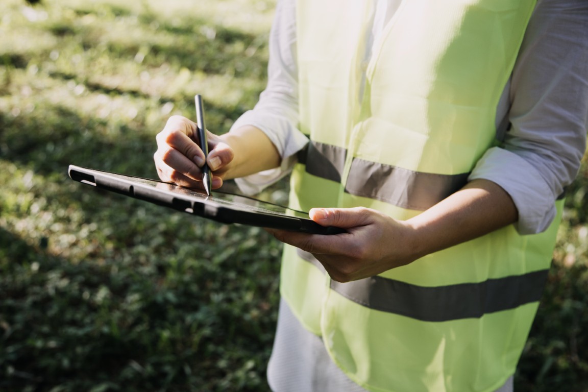 Construction engineer working at blueprint to build large commer